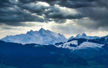 Distant view of the snow covered Santis peak, the highest mountain in the Alpstein massif of northeastern Switzerland