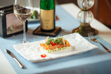 Side view on spanish salmon tartare on avocado