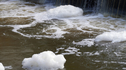 Foaming unclean water, concept of pollution and water contamination