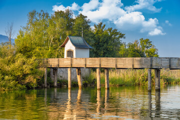 The Holzsteg and the Husli chapel on the shores of the Upper Zurich Lake (Obersee) near Rapperswil-Jona, St. Gallen, Switzerland. An important Way of St. James pilgrim crossing in the middle ages.