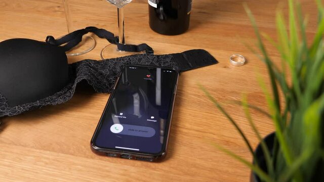 Adultery Concept - Phone Ringing While Disloyal Person is Having an Affair