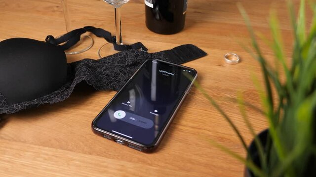 Having an Affair - Girlfriend Calling Man who is Cheating with Mistress, Concept