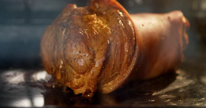 Timelapse Pork knuckle is baked in oven.