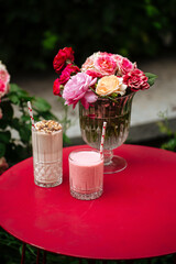 Side view on chocolate and strawberry milkshakes