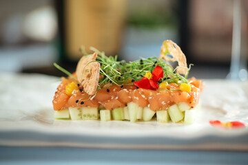 Closeup on spanish salmon tartare on avocado