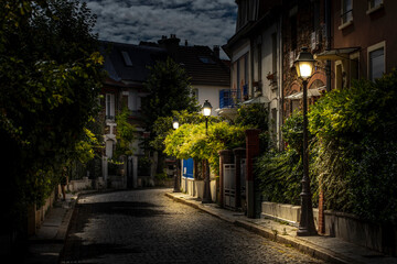 Paris, France - September 9, 2020: Beautiful old house, like in the countryside, in the center of Paris, in the area called "la campagne à Paris" under moon lights