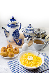 Delicious and healthy Breakfast with corn porridge and baked apples.