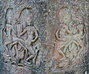 Ancient bas-reliefs depicting people in Angkor