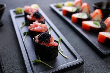 Seafood delicatessen sushi rolls set on plates