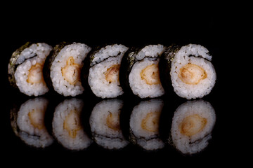 Fresh delicious beautiful sushi rolls on a dark background
