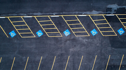 row of empty handicap parking spaces in a parking lot © Tracy King
