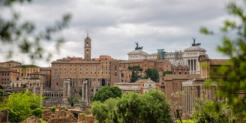 Fototapeta na wymiar Panoramic view of Rome with the Capitoline hill. Great view over ancient Forum Romanum of the Capitol hill with Palazzo Senatorio (City Hall), Vittorio Emanuele II Monumet and Tabularium, Rome, Italy