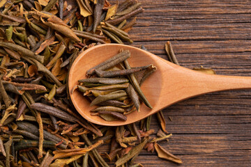 Rhododendron Adamsii in a wooden spoon. Sagan daila tea leaves close up. Sagan daila tea leaves in a spoon. Shaman tea sagan daila.