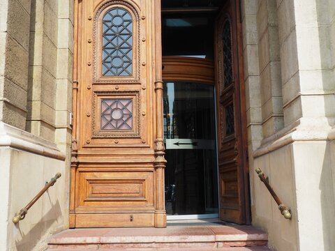 Ornate entrance wooden door of a scientific education institute building in Budapest, Hungary