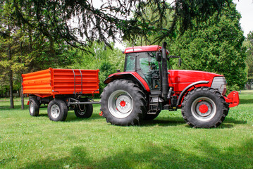 Farmer driving agricultural tractor and trailer