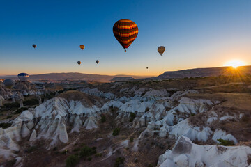Fototapeta premium Hot air balloons at sunrise in Goreme National Park, Cappadocia, Turkey.