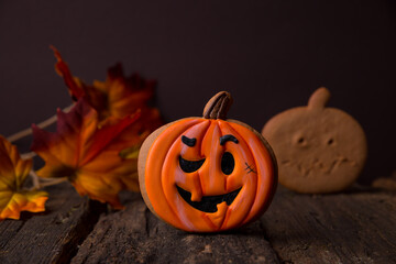  Halloween gingerbreads in the form of pumpkins on a dark background with copy space. background. Children's pastries