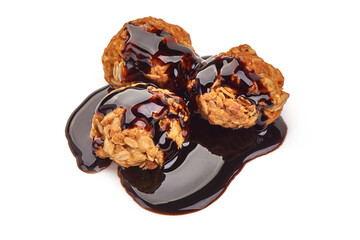 Homemade oat cookies with chocolate syrup, isolated on white background