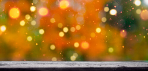 blurred background of autumn leaves bokeh at the bottom of the tree