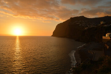 Fototapeta na wymiar The stunning coastline and dramatic mountain landscape on the Island of Madeira in Portugal