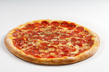 Pepperoni pizza on white background. Copy space. Selective focus