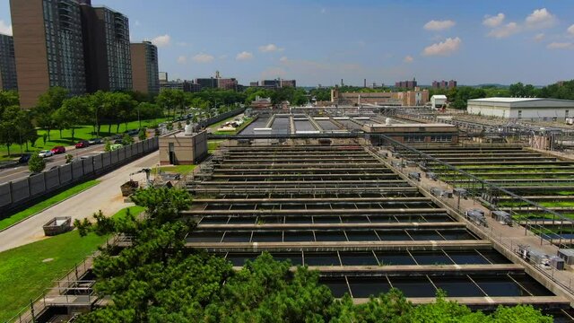Descending Flyover Shot of an Industrial Waste Water Plant in Brooklyn
