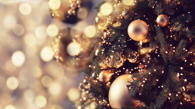 Banner dark decorated christmas tree pine on blurred background bokeh light