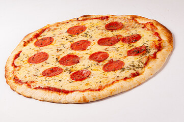 Pepperoni pizza on white background. Copy space. Selective focus