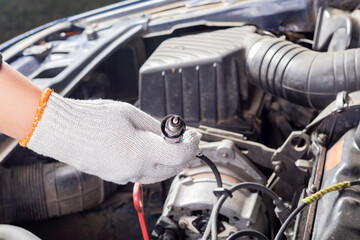 hand in cotton paper gloves. The master holds a spent candle by a wire with a cradle in it. There is a flare.