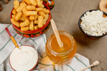 Composition with cottage cheese, honey and sour cream in a rural style
