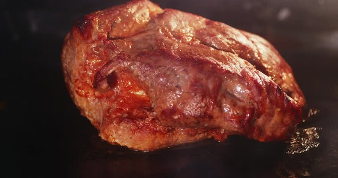Timelapse A piece of marinated pork is baked in oven.