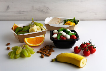 Different types of takeaway food on a light background