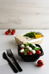 Different types of takeaway food on a light background
