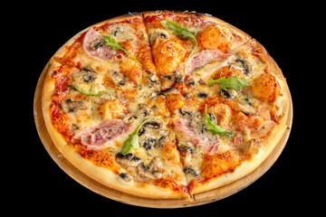Pizza with ham and mushrooms on a thin crust. Black background.