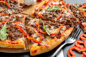 Bolognese pizza with ground beef, cheese, bolognese sauce, bell pepper and parmesan