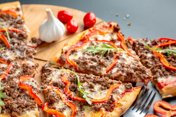 Bolognese pizza with ground beef, cheese, bolognese sauce, bell pepper and parmesan