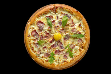 Pizza carbonara. Contains egg yolk, cream, bacon, parmesan. Served on a black background.