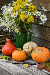Pumpkins on a wooden table, harvesting in autumn. Countryside, still life