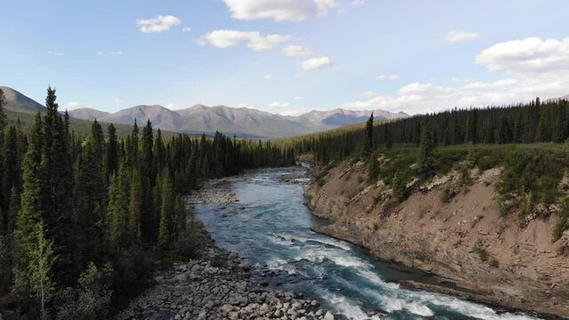 Flowing River with Mountains