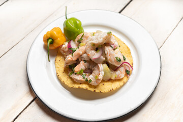 Mexican shrimp raw aguachile on white background