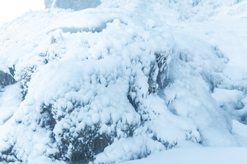 Mountains frozen with ice in winter. Earth, stones are covered with ice
