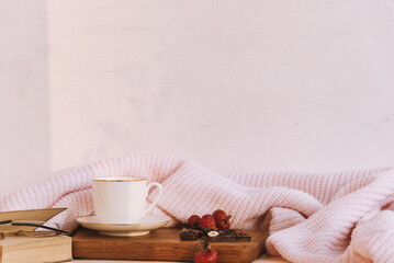 Cup of tea and chocolate, soft blanket and book