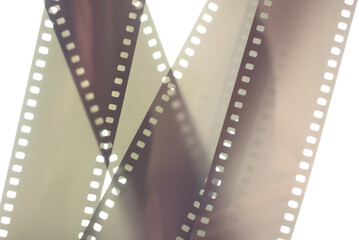 Photographic film background. 35mm negative film tapes on a white background.