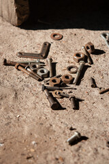 кгіе bolts and  nuts on a concrete slab