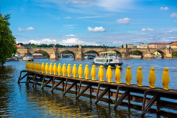 Zelfklevend Fotobehang Art object march of yellow penguins. Weird art statues of Prague © Kate