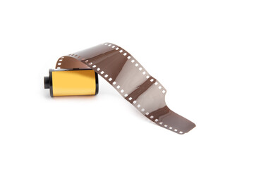 a roll of 35 millimeter photographic film unrolled isolated on white
