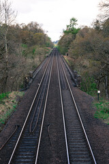 Fototapeta na wymiar Railway, Railroad, Train Tracks - sad double train tracks in rural area