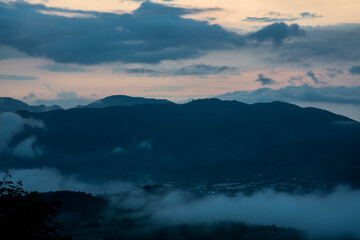 dramatic image of mountain landscape in the caribbean town of Ocoa, Dominican Republic. during sunset, cloudy skies.