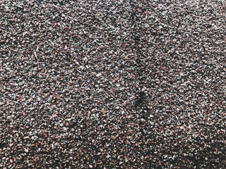 texture, many stones of different colors. natural background. small stones, home decoration, decor and wall decoration. liquid wallpaper. shiny, uneven, voluminous texture