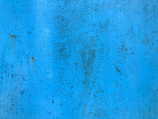 texture in blue. bright, matte surface of unusual color. metal sheet with paint smudges, damage, corrosion and rust. home decoration, decor, paint walls and home